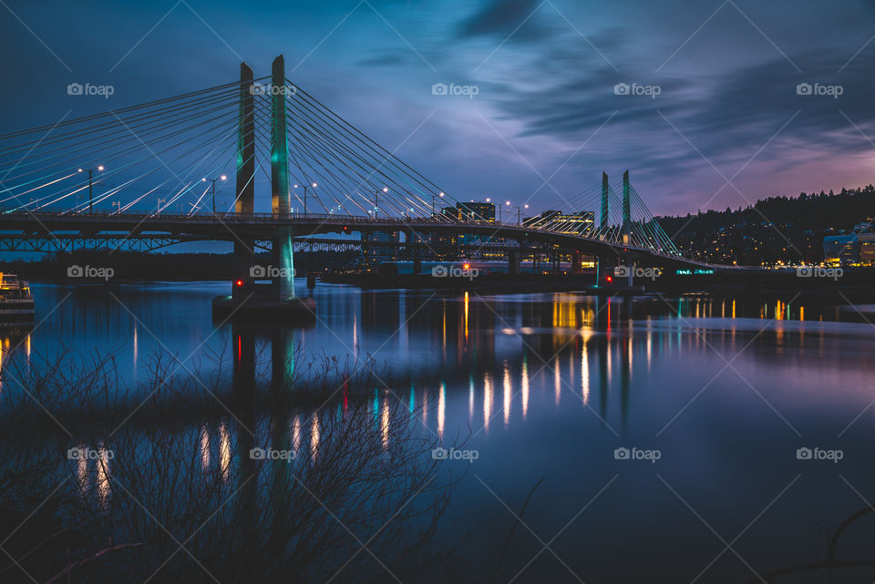 Blue hour reflections on the waterfront at Tilikum crossing bridge in Portland Oregon 