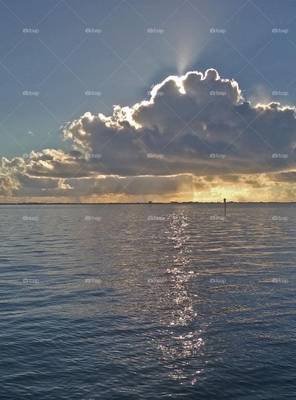 Sunrise with clouds on the river