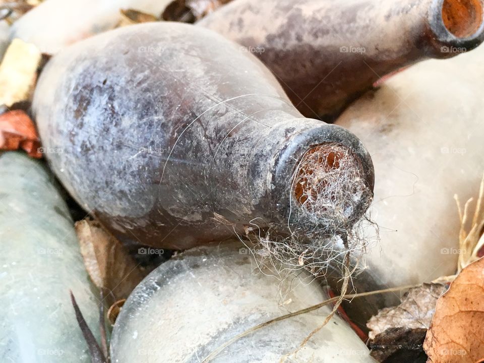 Cobweb filled antique old retro vintage bottles 