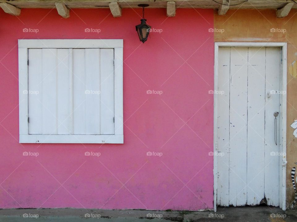 Cute pink door with white windows