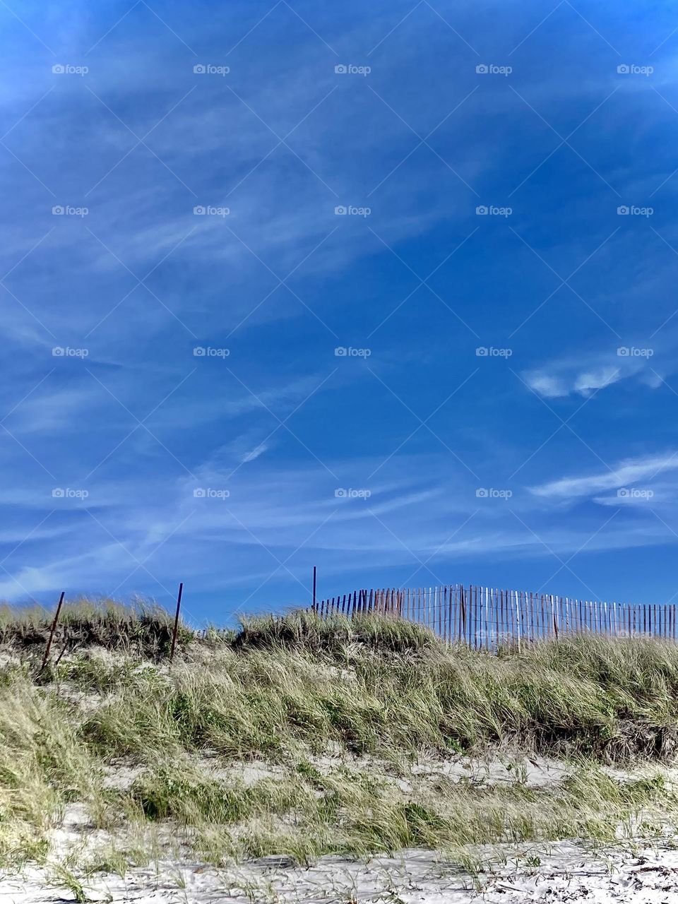 Wispy clouds overlooking the beach