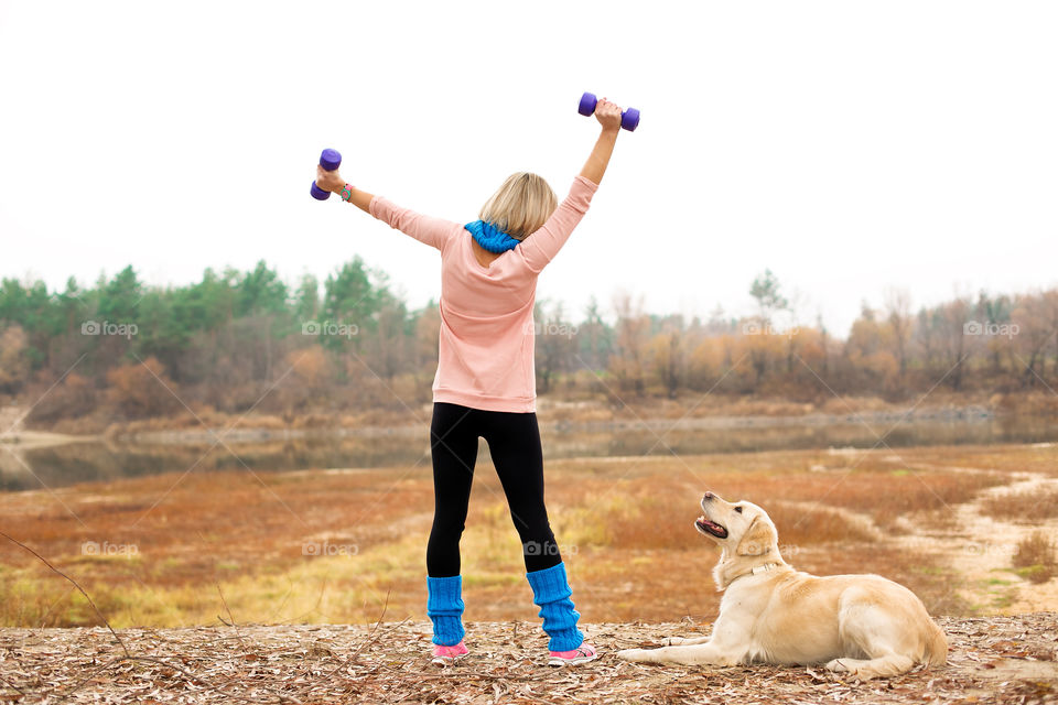 Rear view of girl with dog