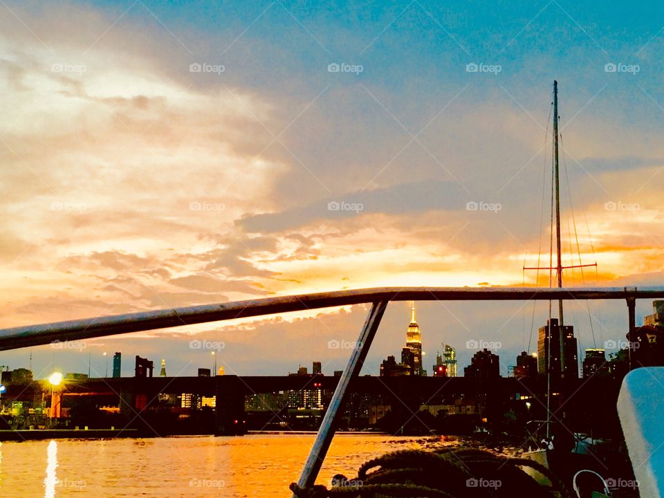 From our sailboat, the “Salvation” we took this picture of the sunset over Newtown Creek in Long Island City, Queens, NY. In the far distance you can see the Manhattan skyline and the Empire State Building. 2018. Hypnotic Productions