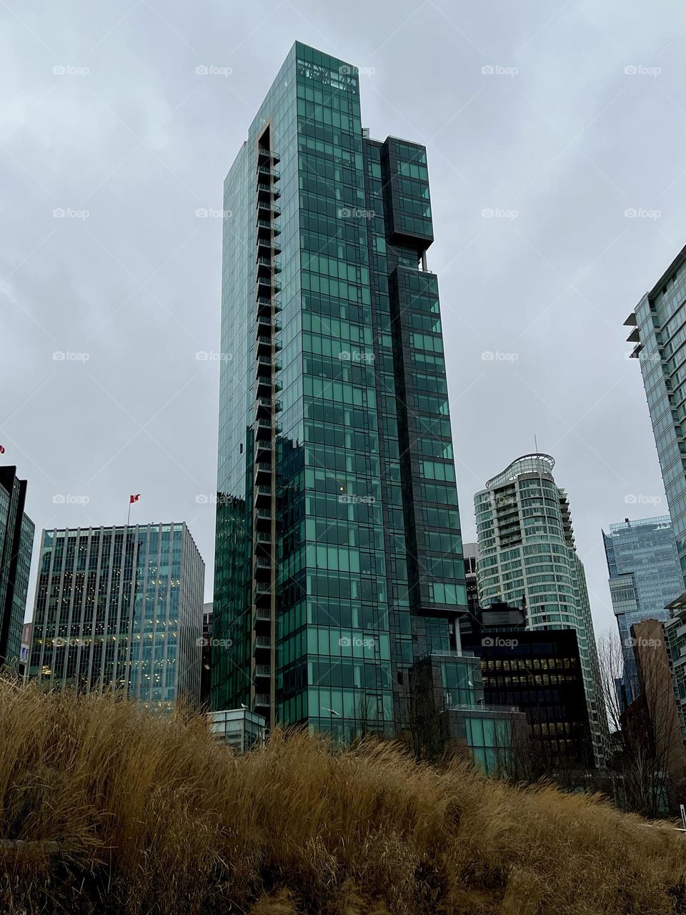 View of the Three Harbour Green building from the Seawall Adventure Centre bike lane in Vancouver British Columbia 