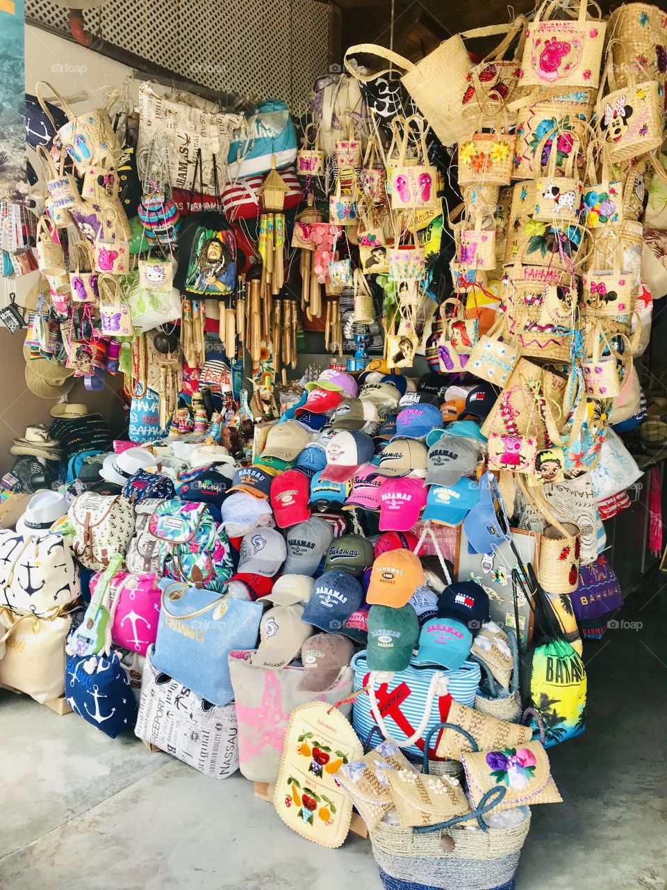 Beautiful arrangement of colors in all of this homemade merchandise at a straw market in the Eastern Caribbean! 