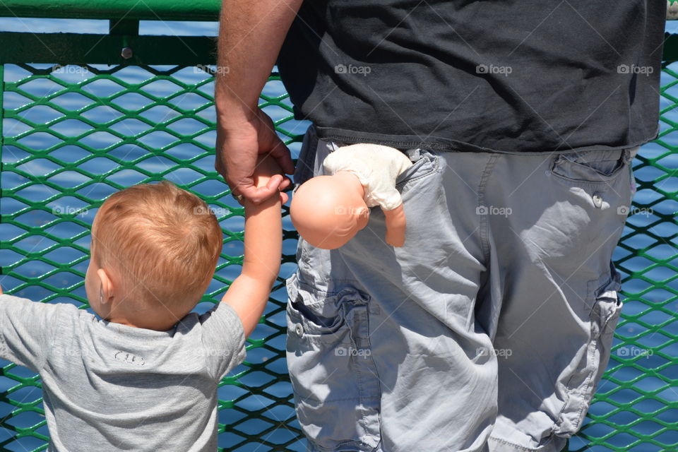 Father with doll in his pocket 