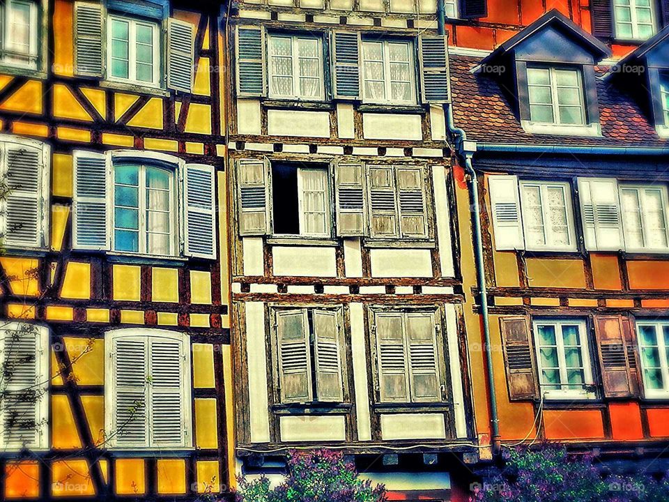 open window. facade of ancient houses in france