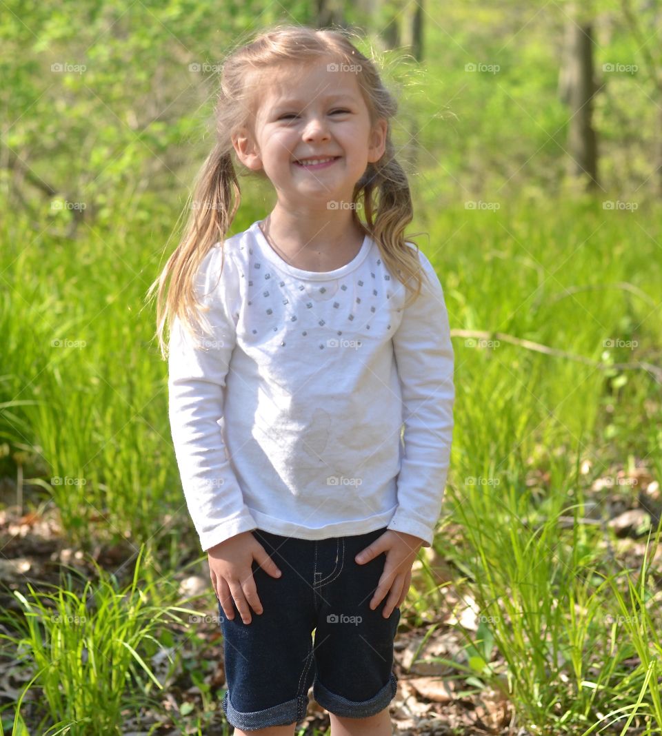 Cute girl standing on field