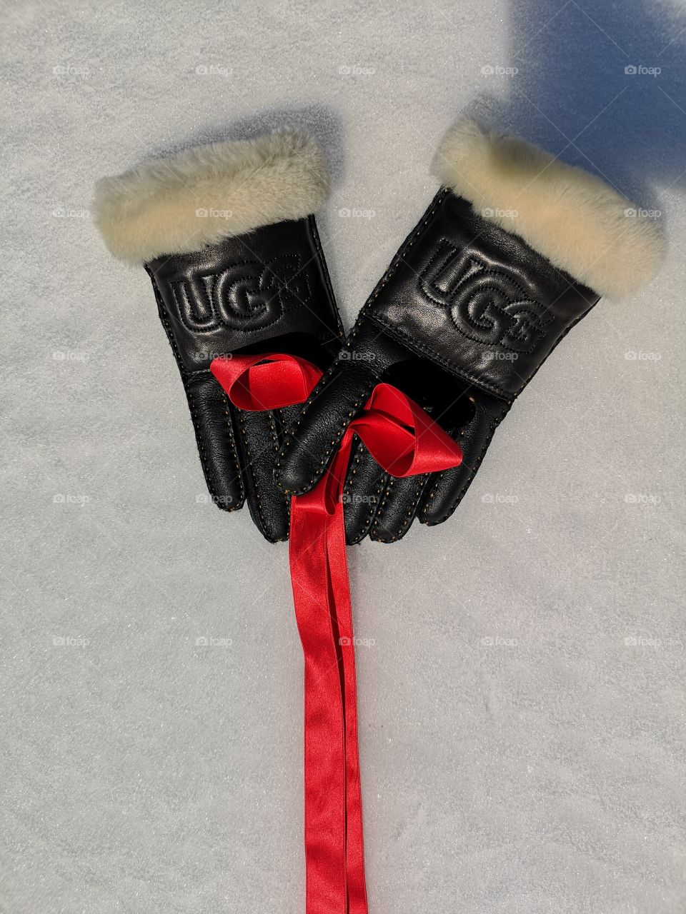 UGG present gloves on ice.