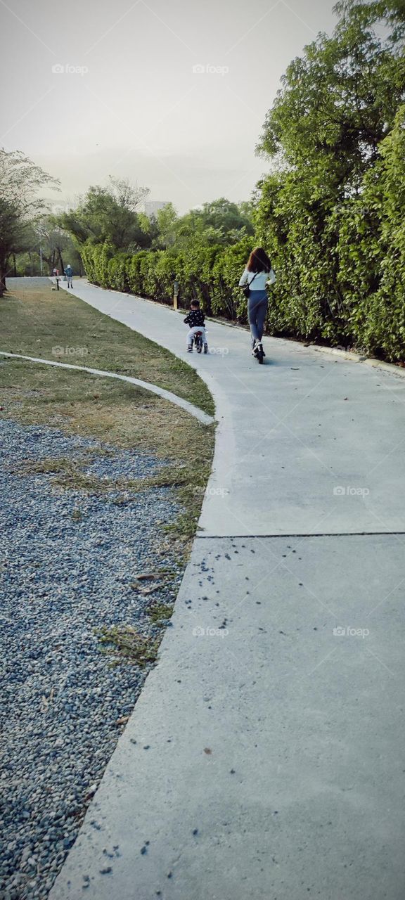 Mother and son getting around in the park