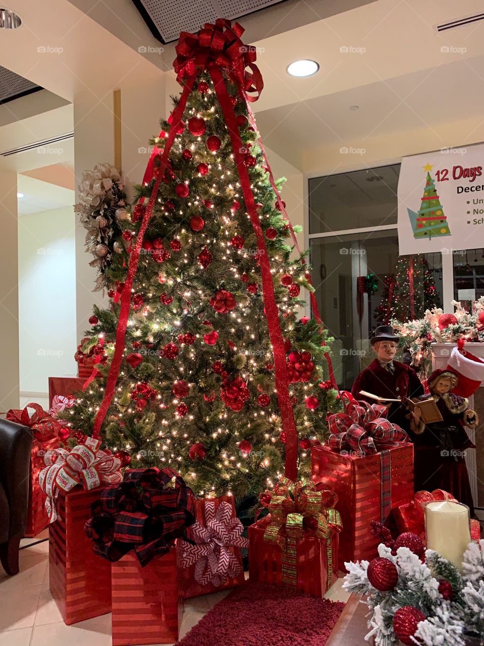 Beautiful Christmas tree and lots of wrapped presents.