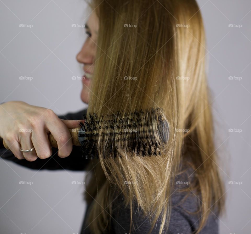 Woman brushing hair