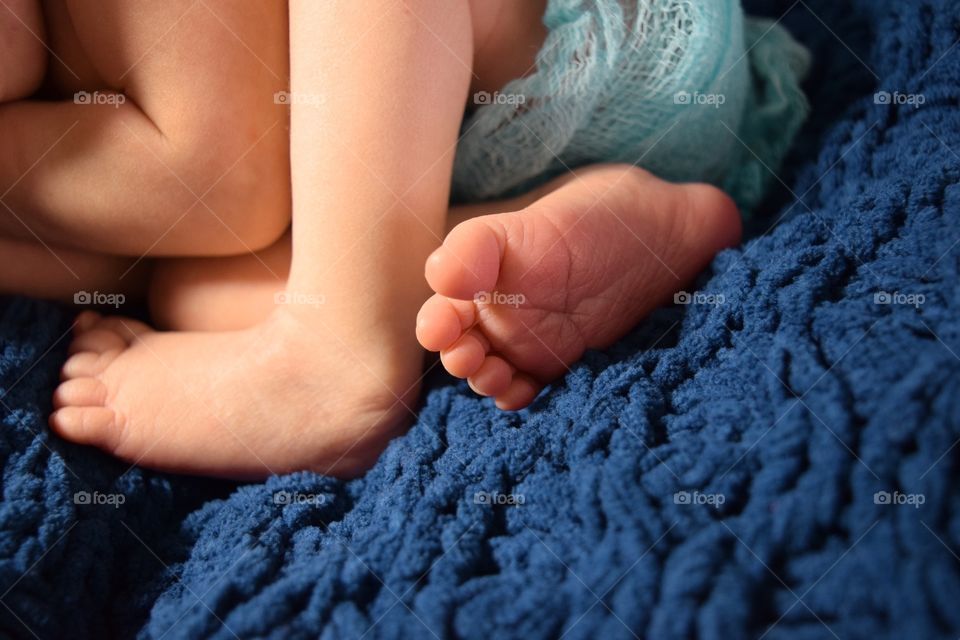 High angle view of new born baby foots