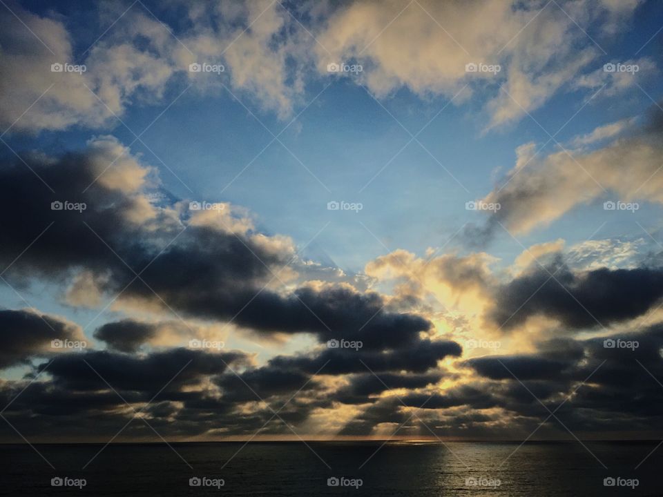 Scenic view of sea against cloudy sky