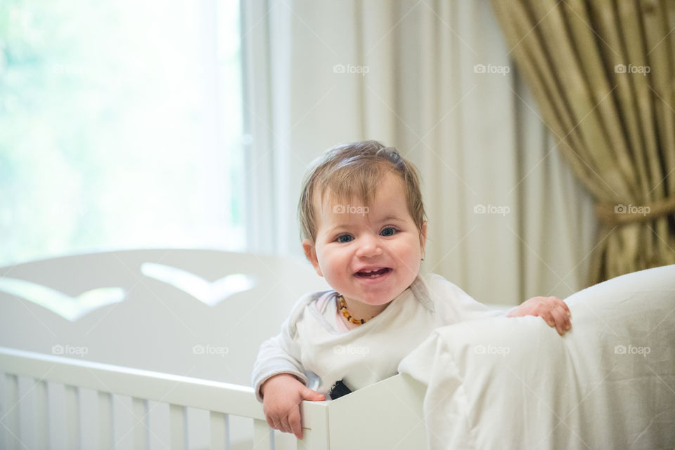 Portrait of a cute baby in cradle
