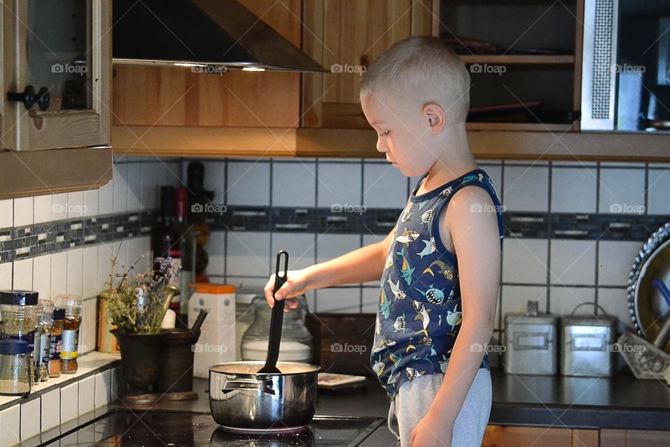 Boy cooking food