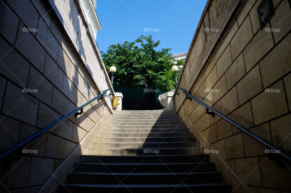 Low angle view of steps leading from metro station to Vörösmarty Square in Budapest, Hungary.