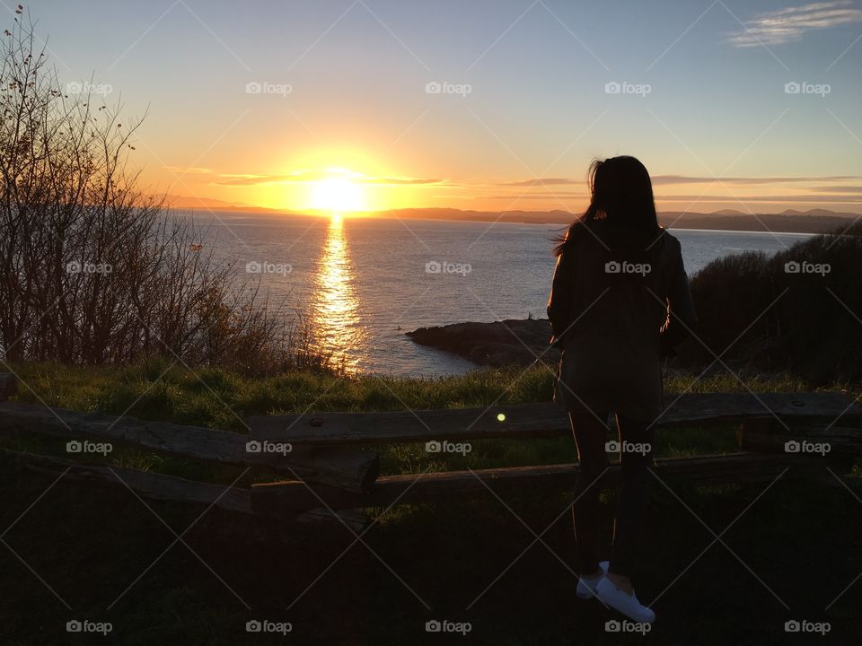 Girl watching the sunset