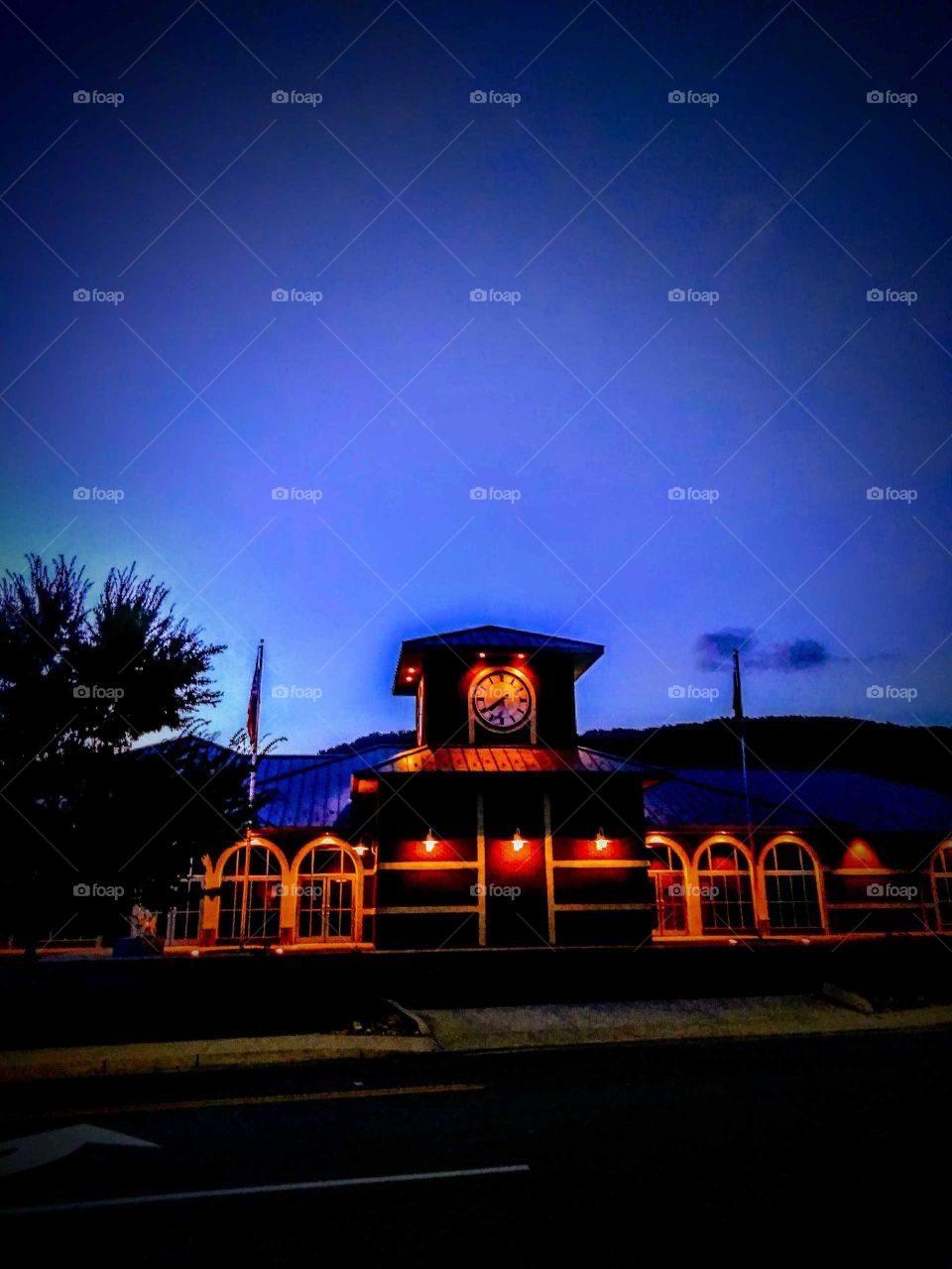 Beautiful Town Hall with clock included in a little town in Appalachia accompanied by a gorgeous blue sunset in the background.