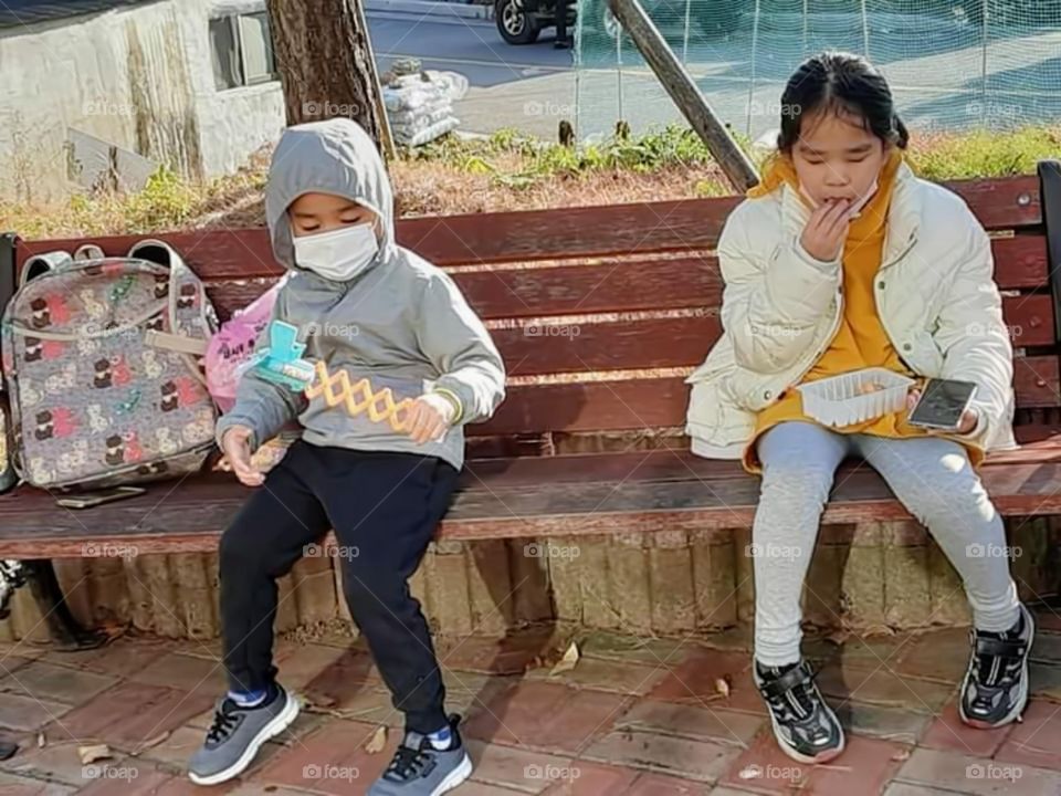 playing  outside on our way home  and having some snacks.