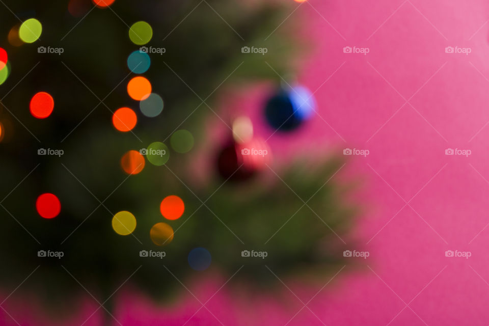Christmas tree with light garlands,  blurred effect