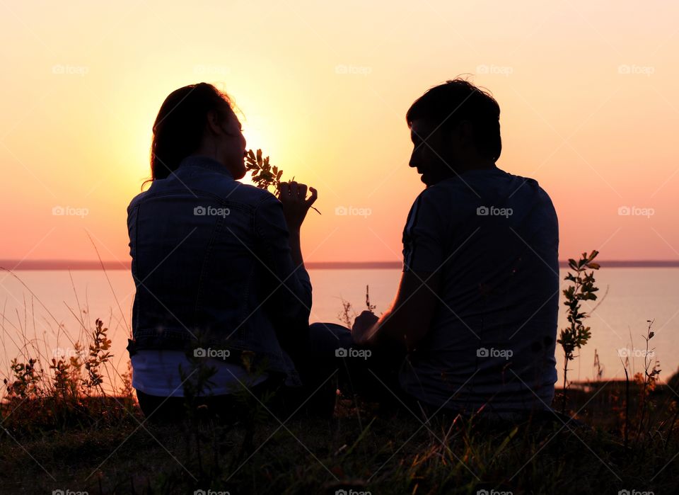 silhouette couple in love on the sunset