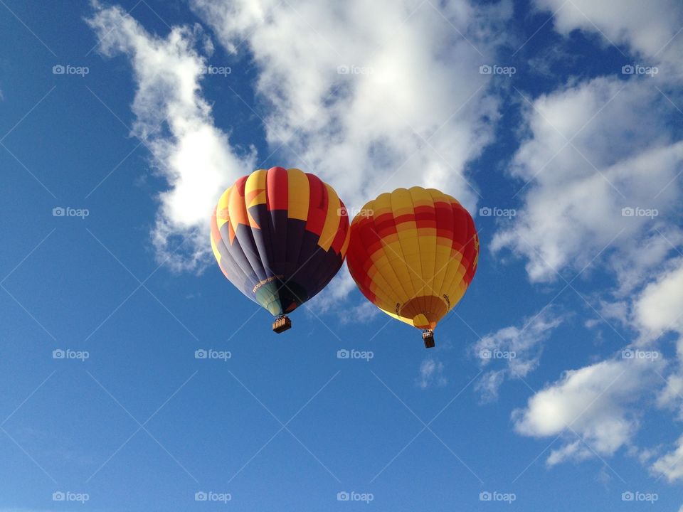 Two hot air balloons touching after lifting off from the Albuquerque International Balloon Fiesta.