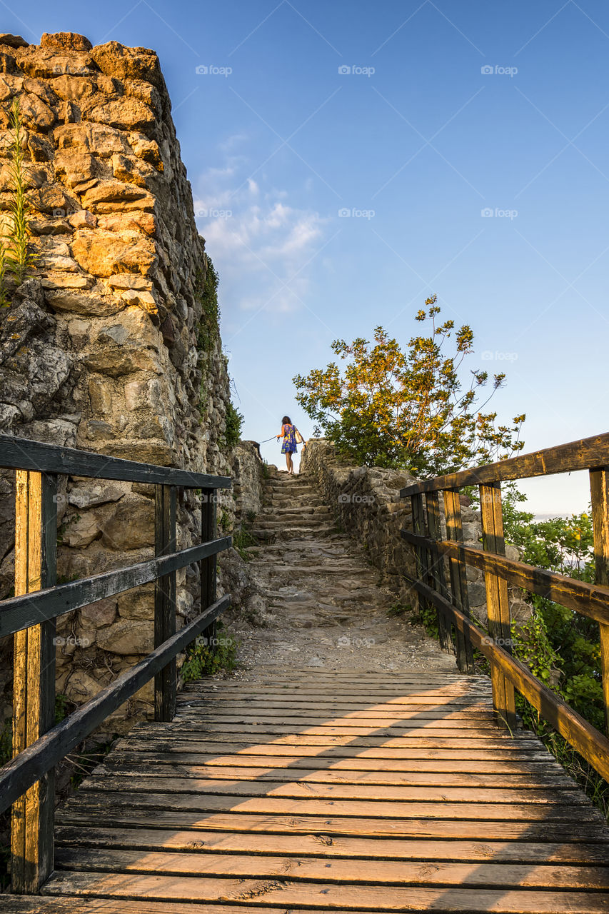 Reaching the top of the "Rocca di Manerba", the ruins of an ancient castle built in the 12th/13th centuries in the southwest part of lake Garda, north Italy.