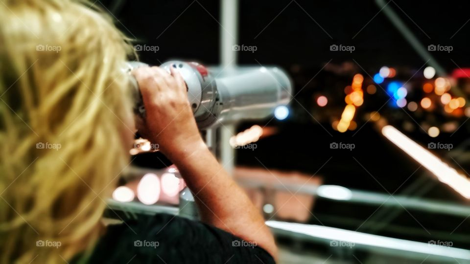 A woman looking the view from Stavros Niarchos foundation cultural centre in Athens