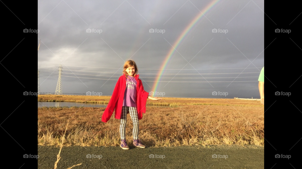 Girl holding  rainbow