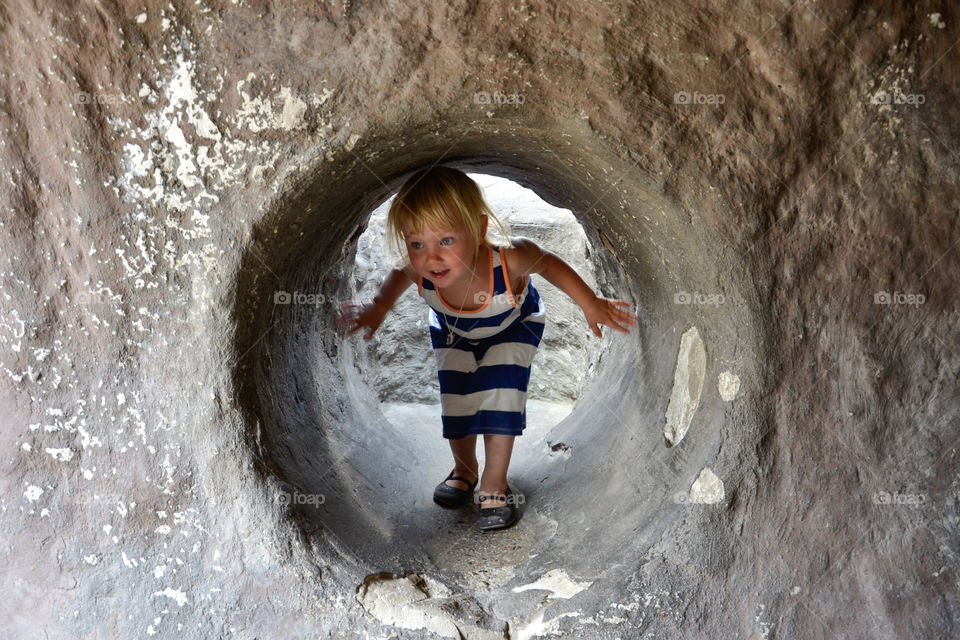 Young girl playing at a playground in Copenhagen Zoo.