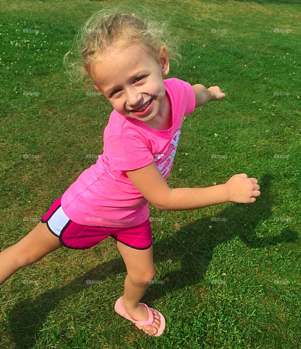 Close-up of a cute girl on grass