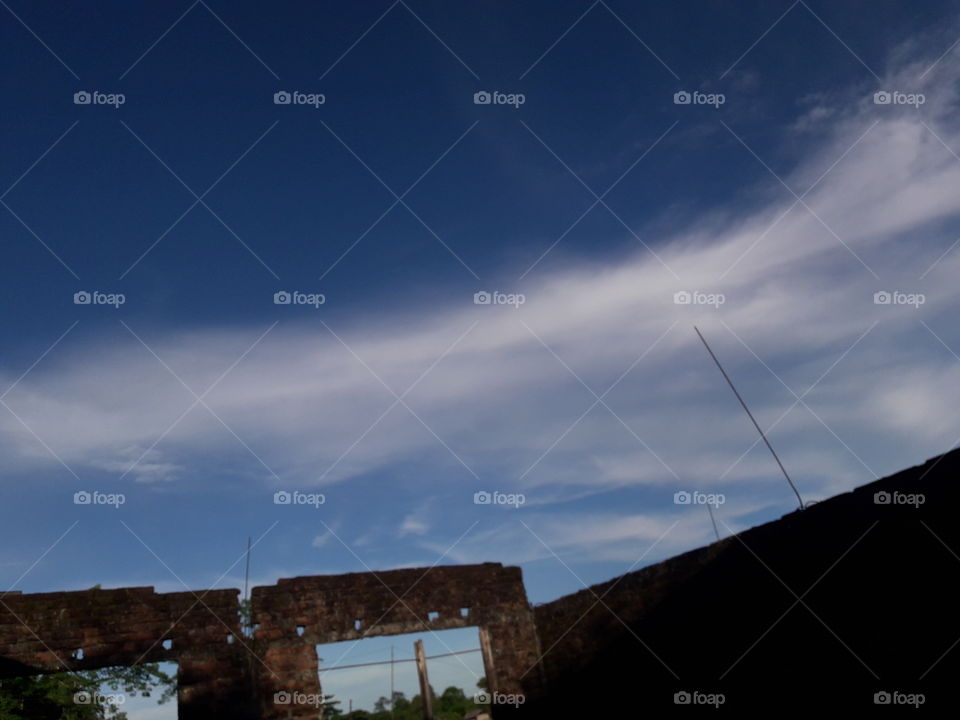 Blue polish sky with break windo