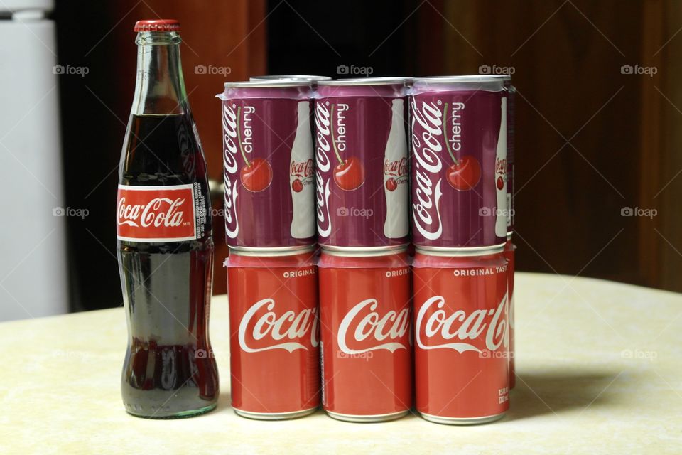 Coca Cola and cherry coke cans and bottle 