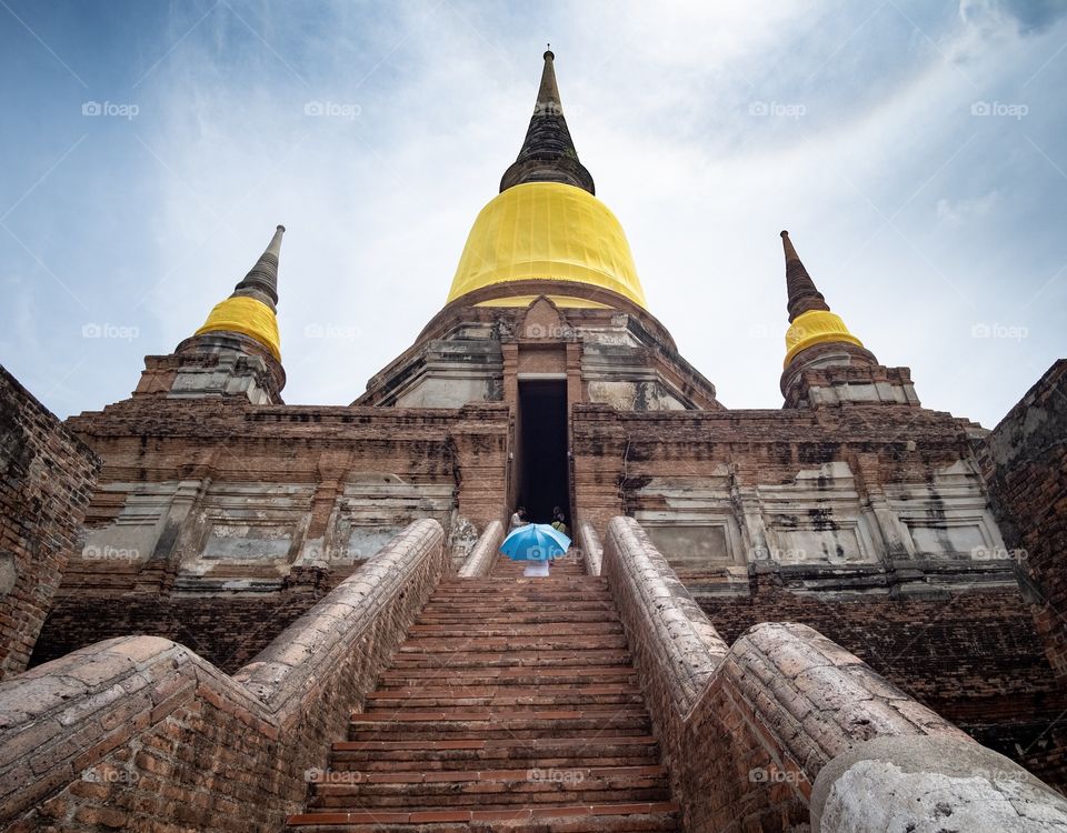 Tourists visit Wat Yai Chimongkol formerly named "Wat Pa Keaw" or "Wat Chao Thai" Located at Aytthaya Thailand. Highlights of the Temple is the big Pagoda is located on the East side of Ayutthaya.