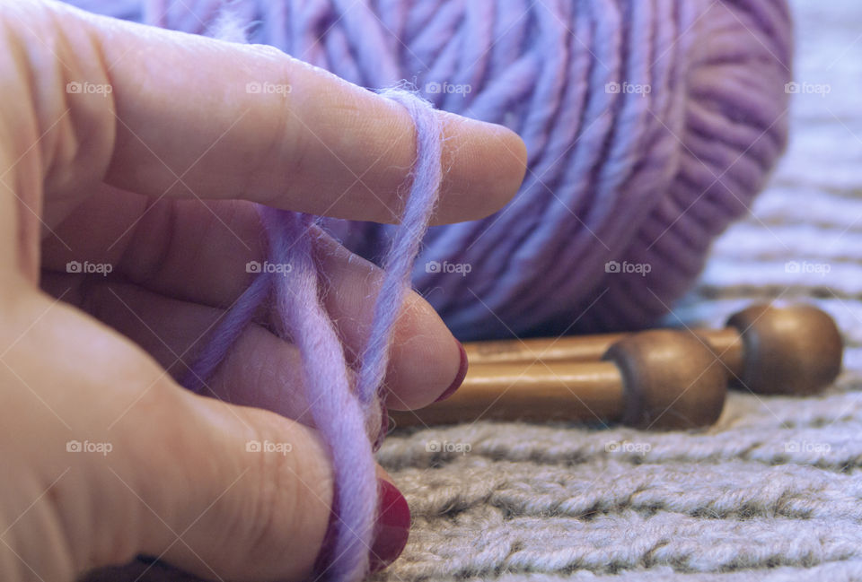 Women's hand with wool