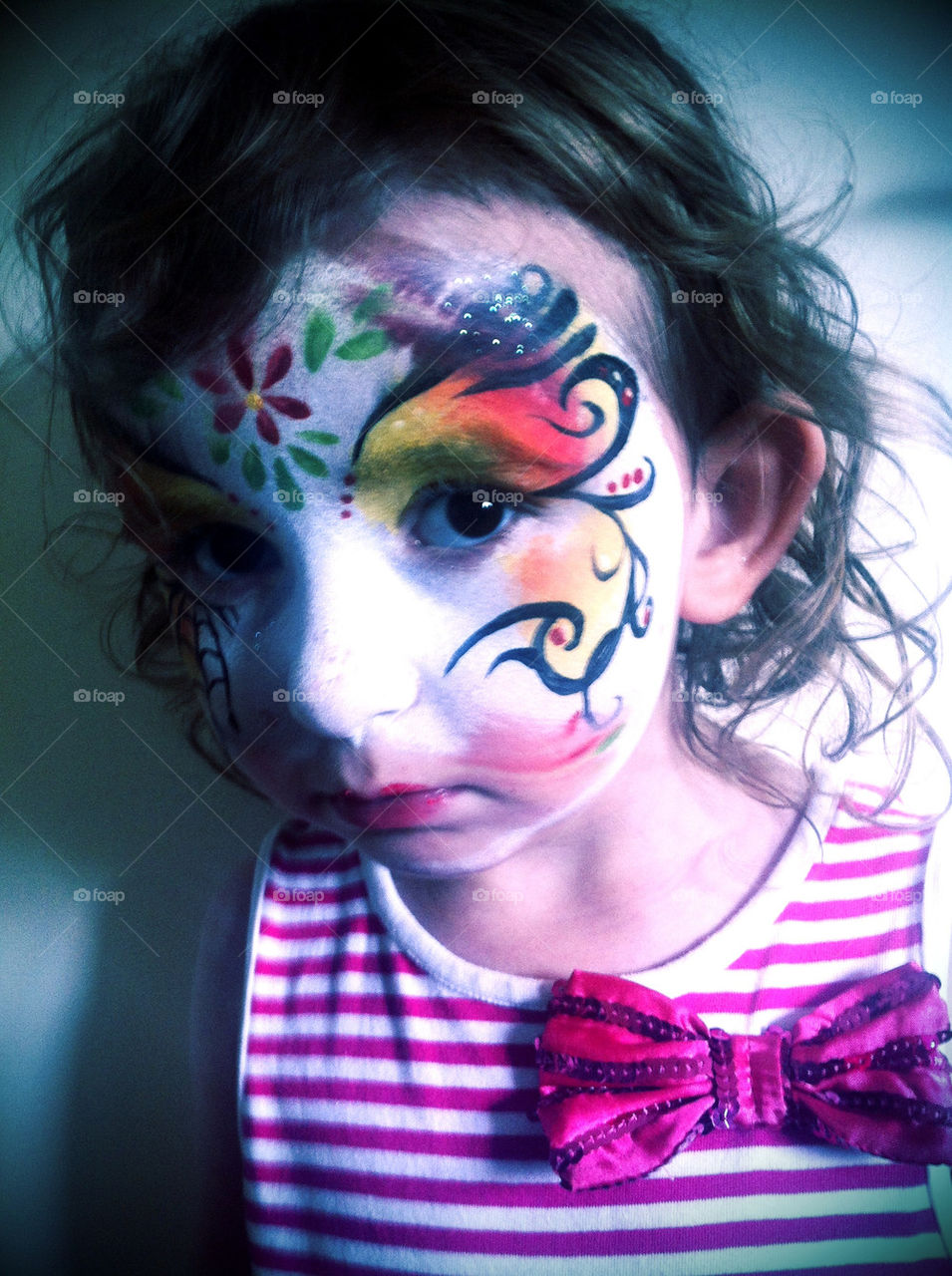 Girl with smeared face paint
