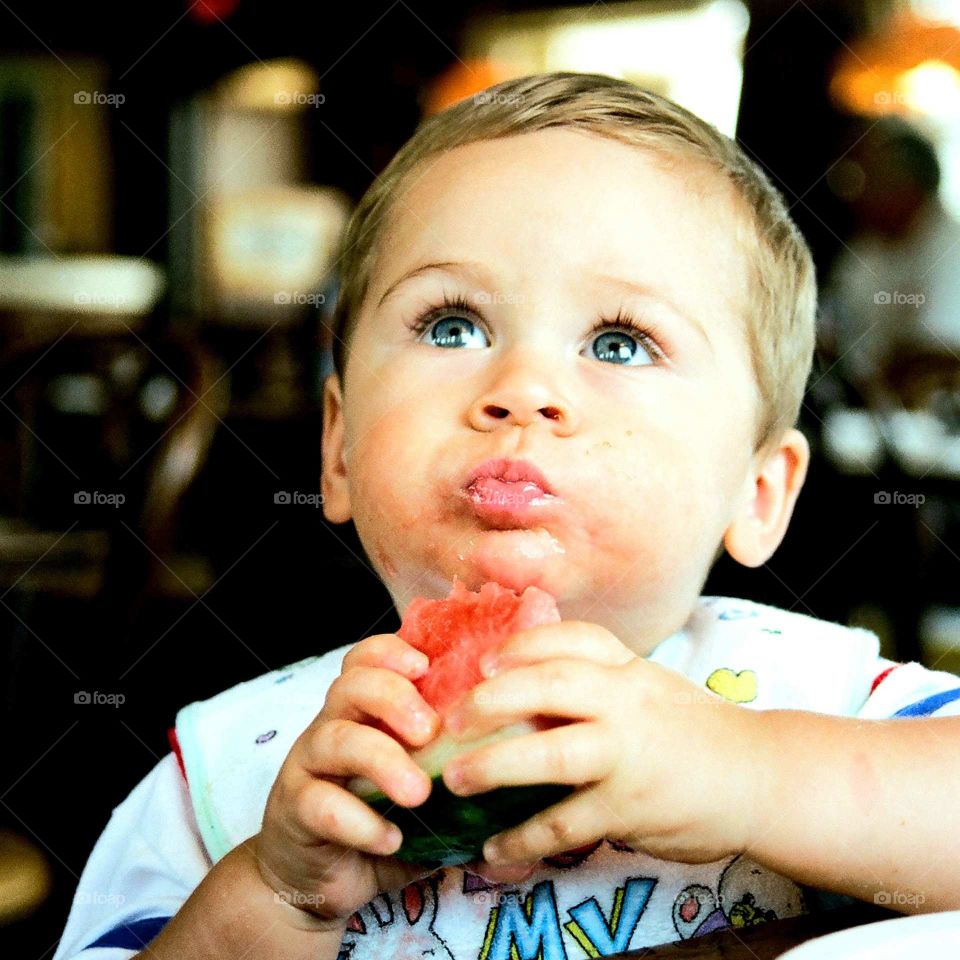 Beautiful Blue-eyed Boy Eating Watermelon