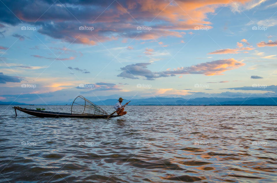 Intha fisherman fishing in lake
