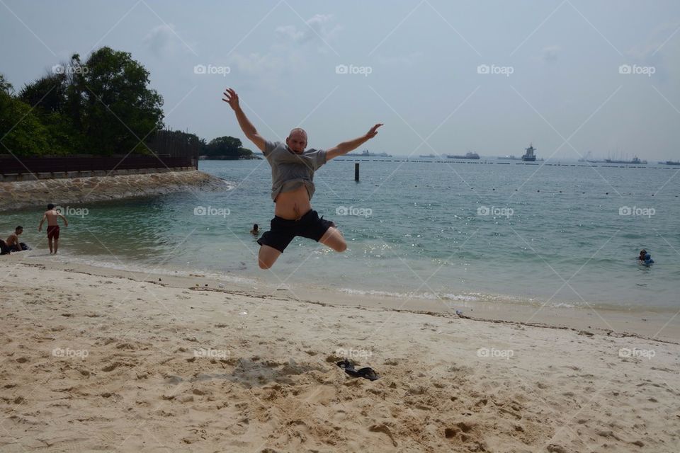 Man jumps on beach