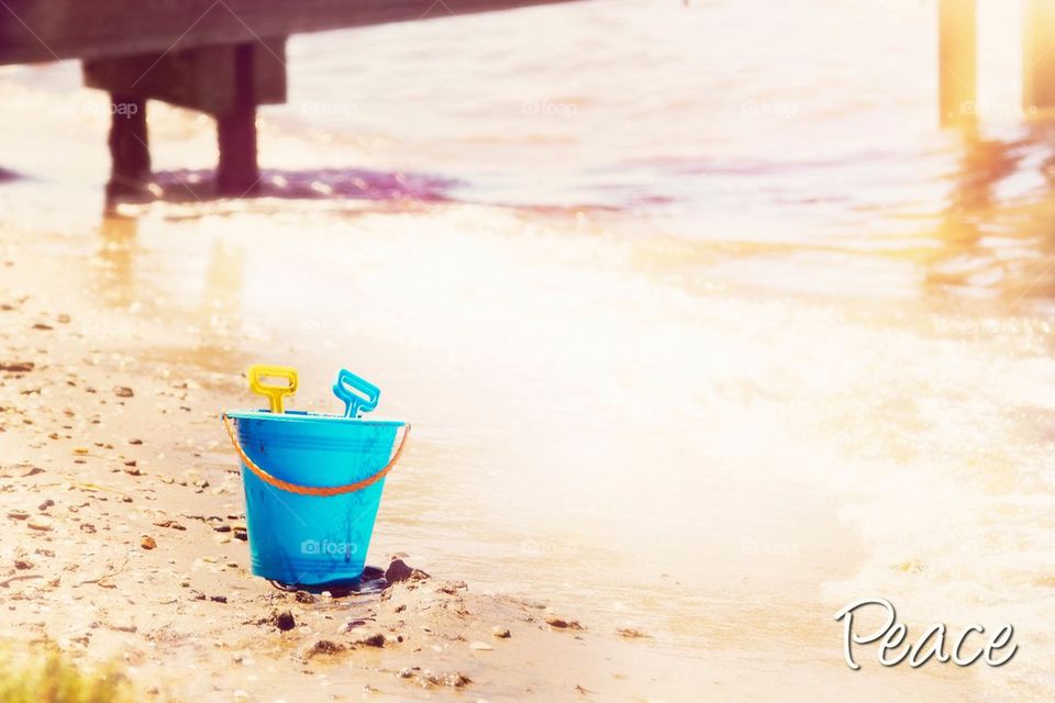 Peace day at beach sand bucket