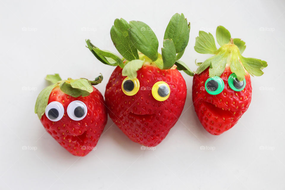 Red strawberries on white background