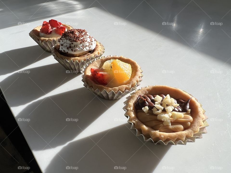 Assorted homebaked Fruit tarts and Nutella chocolate nut butter tarts 