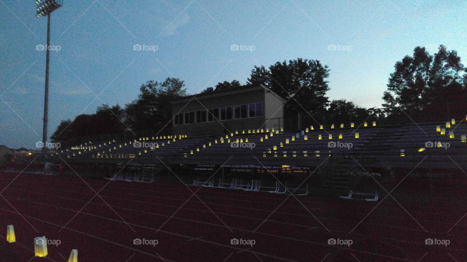 Hope spelled out on bleachers at Relay for Life with memorial lanterns