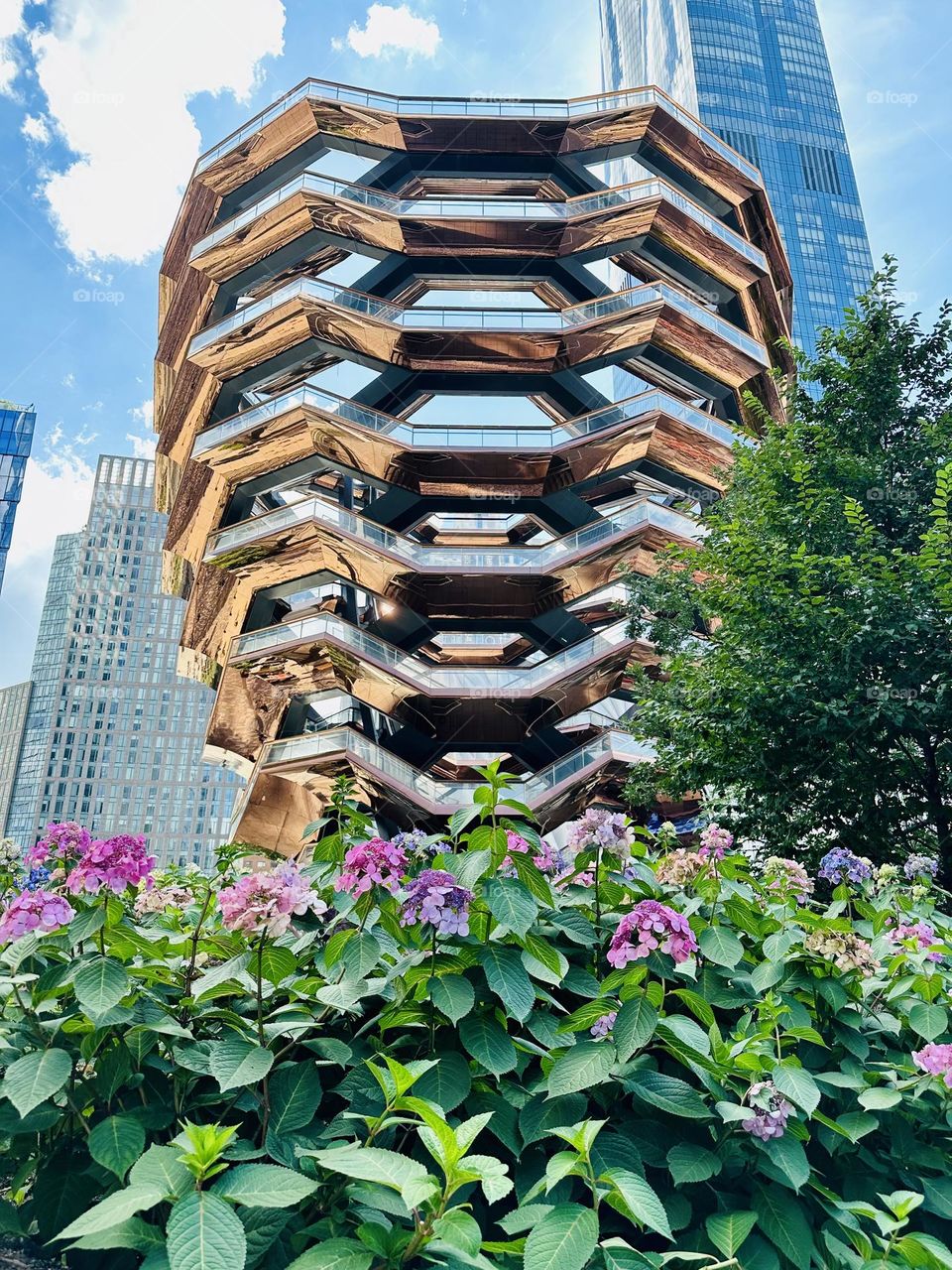 The elaborate honeycomb-like structure of the Hudson Yard Vessel is a copper  like fall color. 