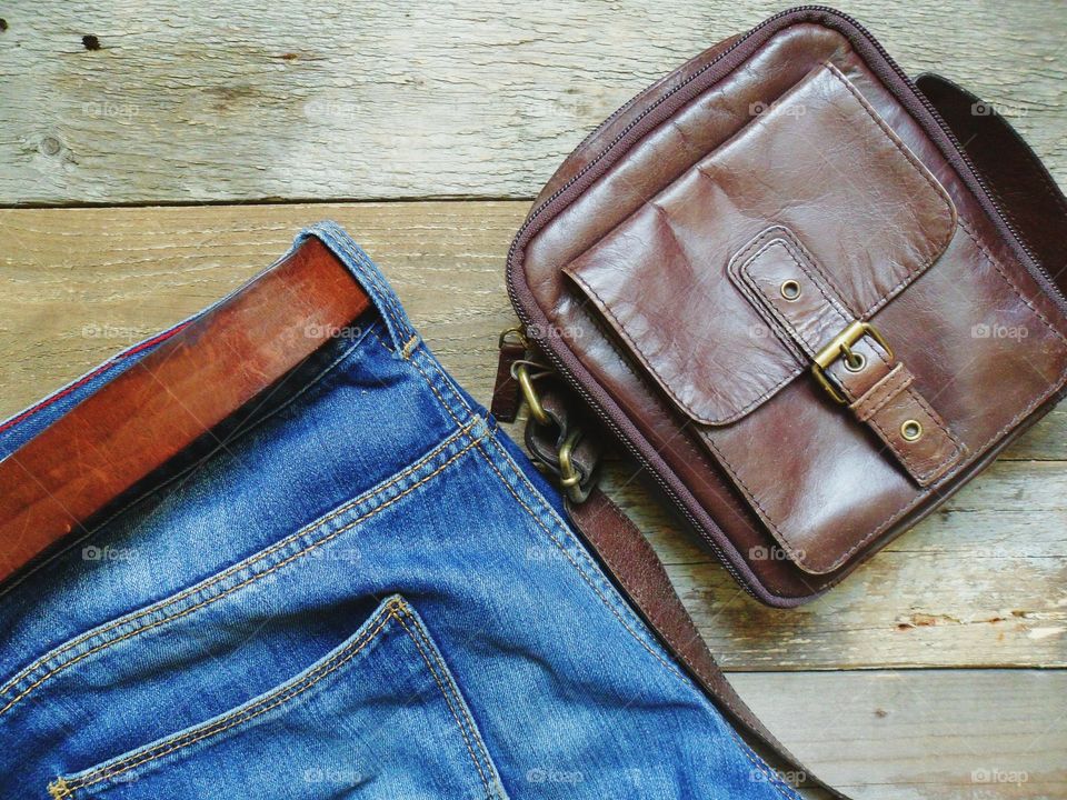 Blue jeans and leather mens bag