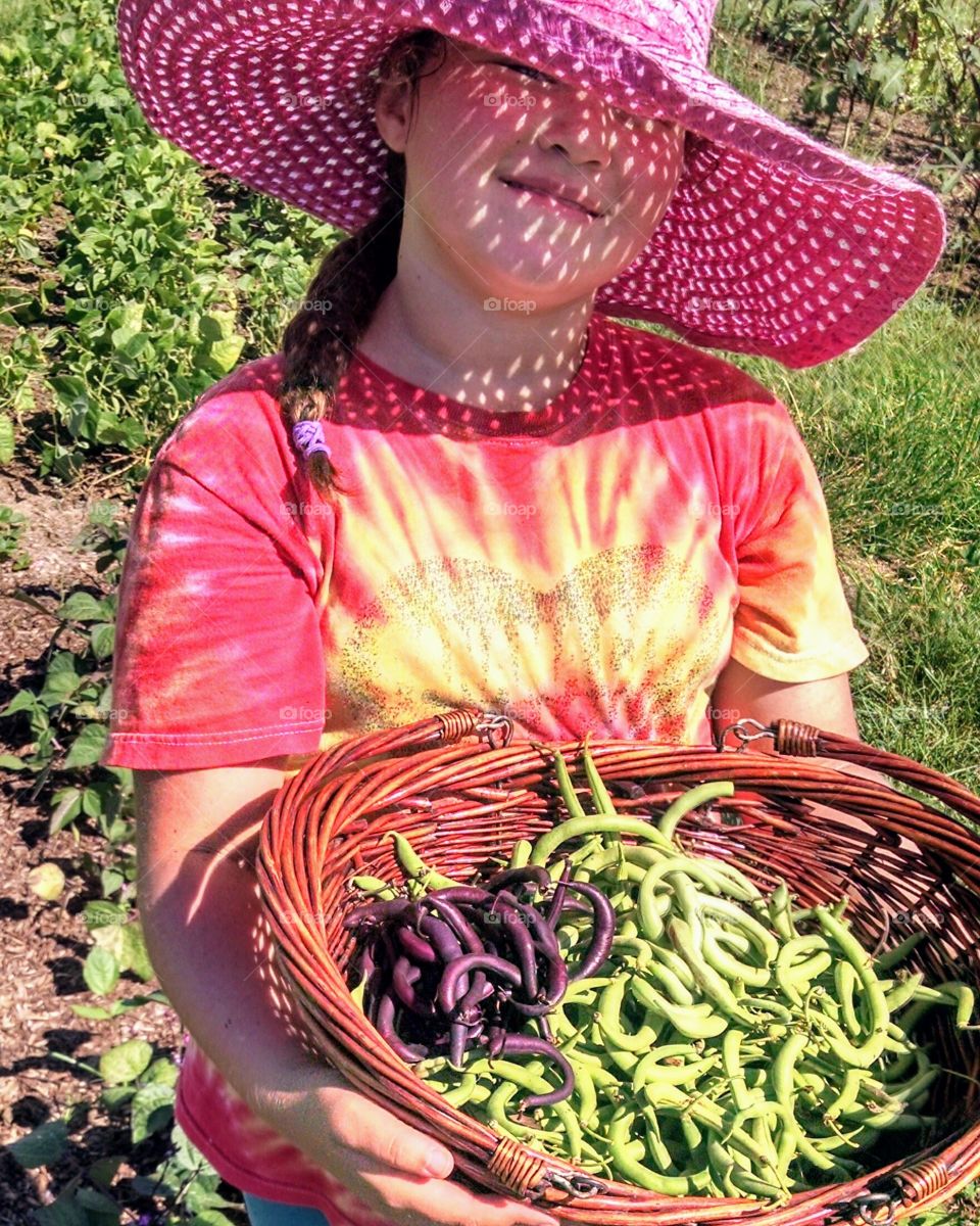 Girl in a Hat with Basket of Green Beans and String Beans