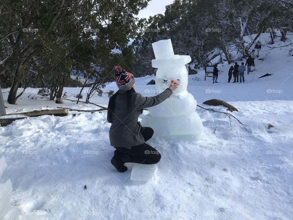 View of the frozen statue in snow decorating Christmas in July at Mt Baw Baw