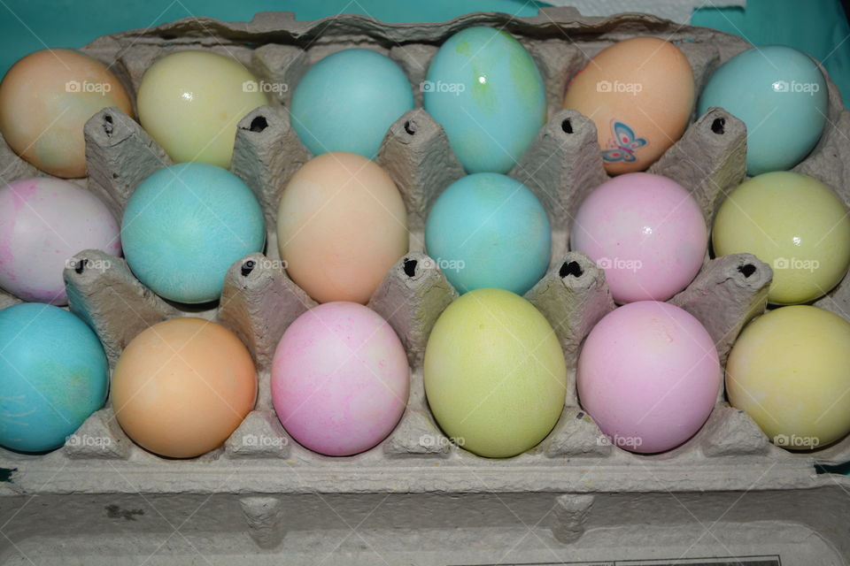 Dyed Easter eggs in an egg carton that the kids dyed 
