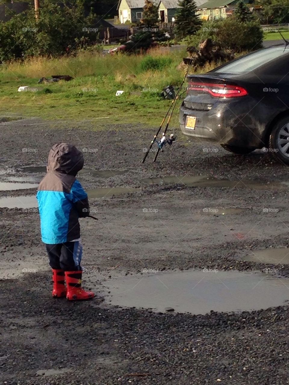 Boy at puddle